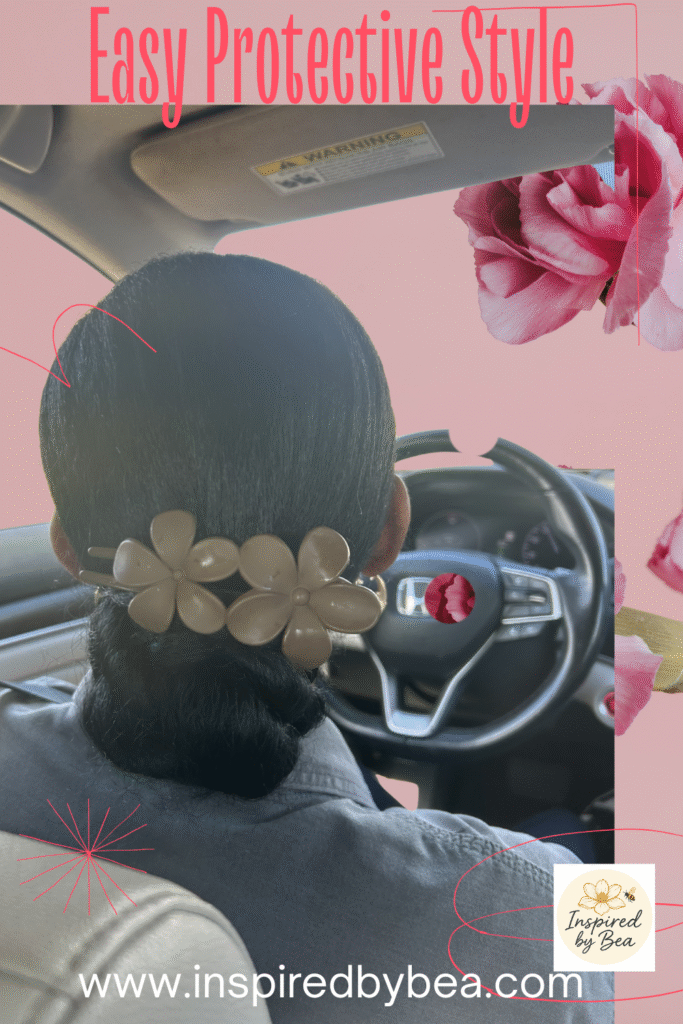 "Easy protective style for natural hair-sleek bun with floral hair accessory.
